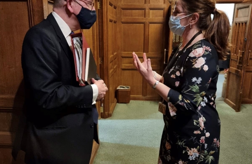 Caroline talking to Michael Gove on cladding issues affecting Eastbourne residents