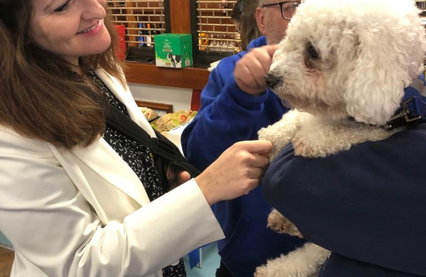 Caroline meeting a support animal working in the NHS