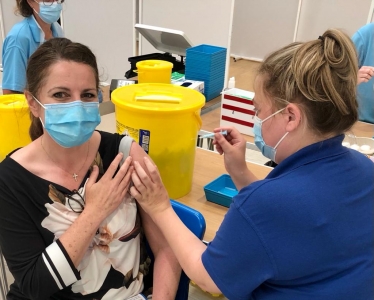 Caroline receiving her second vaccination in June