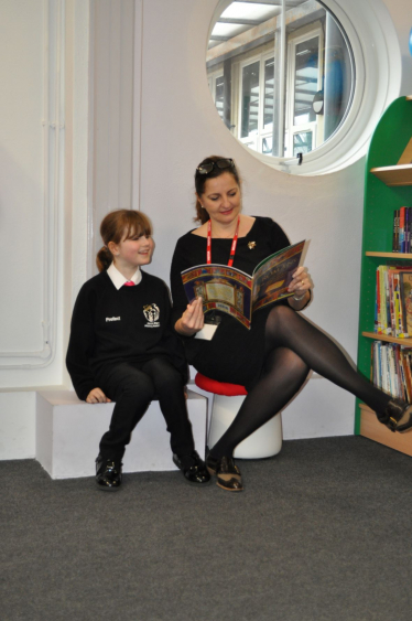 Caroline Reading at the Library